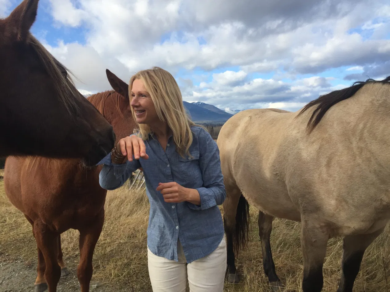 Ingrid with horses in nature